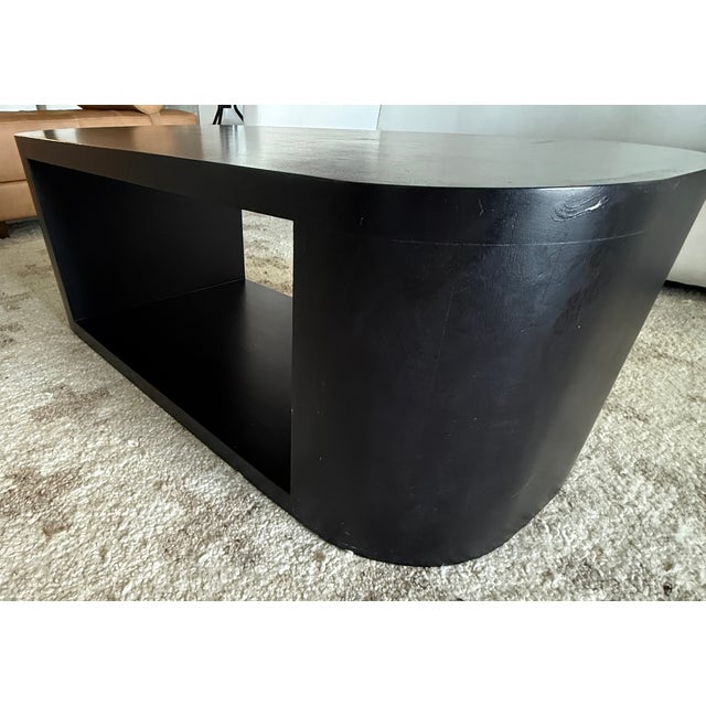 Elevate your living space with the architectural silhouette of the Luna Oval Coffee Table from Lulu and Georgia. This...
