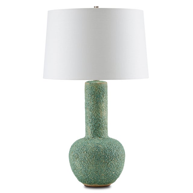 When heavy-hitting texture is desired, the Manor Table Lamp brings it in spades. Made of a heavily pitted ceramic in a...