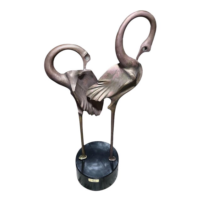 Monumental and exceptionally elegant, this signed bronze flamingo sculpture was designed and sculpted by celebrated Thai...