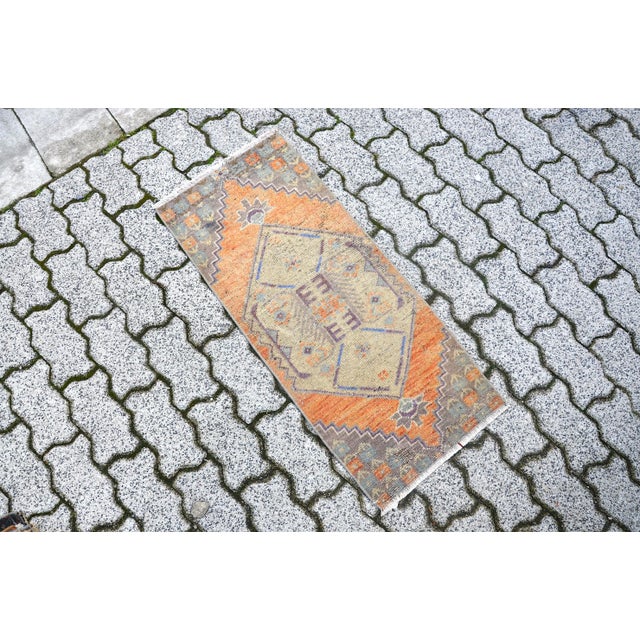 This is a vintage Turkish Oushak rug from the 1960s. The piece was hand-knotted.