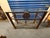 Vintage Brass & Glass Console Table – Ornate Metal Base With Floral Medallion Detail For Sale - Image 9 of 10