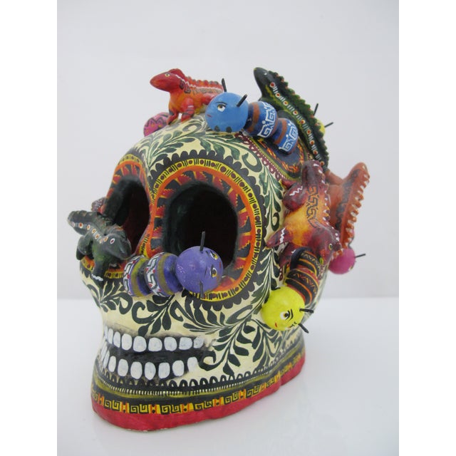 Fantastic hand-painted ceramic skull sculpture, a traditional folk art piece created by renowned Mexican master potter...