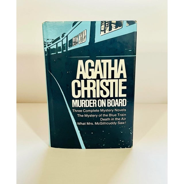 A classic trio of Agatha Christie novels in hardcover with original dust jacket. -The Mystery of the Blue Train -Death in...