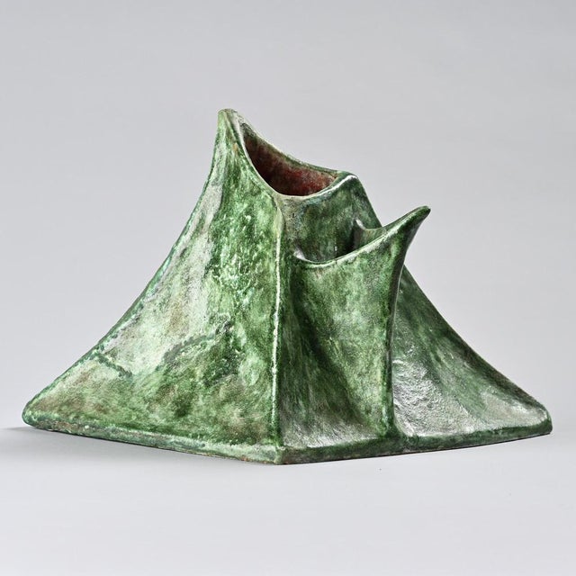 A mixed-clay vase with a wiped glaze, created by Béatrice Cenci. The free and irregular forms evoke a volcanic landscape,...