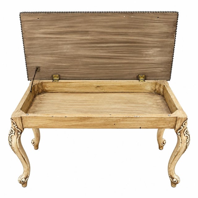 Beautiful antique French Louis XV style bench featuring an intricately carved and distressed wood frame with elegant...
