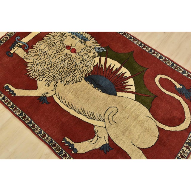 An authentic vintage traditional Yalameh rug hand-knotted with fine wool and natural dyes. This intricately woven rug...