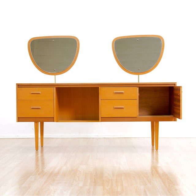 This mid-century vanity was produced by Lebus Furniture during the 1960s. A classy looking modernist vanity featuring...