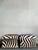Elevate your interior with this striking pair of vintage zebra skin ottomans, embodying a perfect blend of exotic allure...