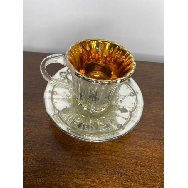 Spectacularly rare and beautiful Victorian mercury glass teacup and saucer with clear handle, interior gold wash, delicate...