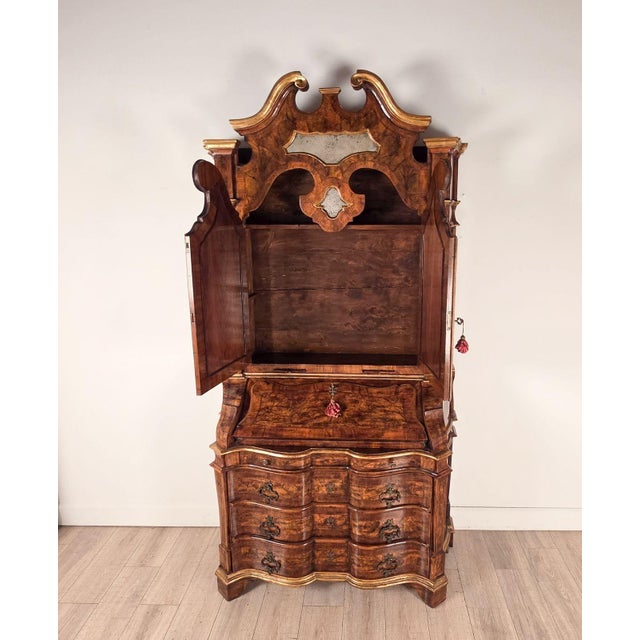 The Baroque Style Secretary is a wonderful bench made copy of an 18th Century olive and burl walnut Italian mirrored...