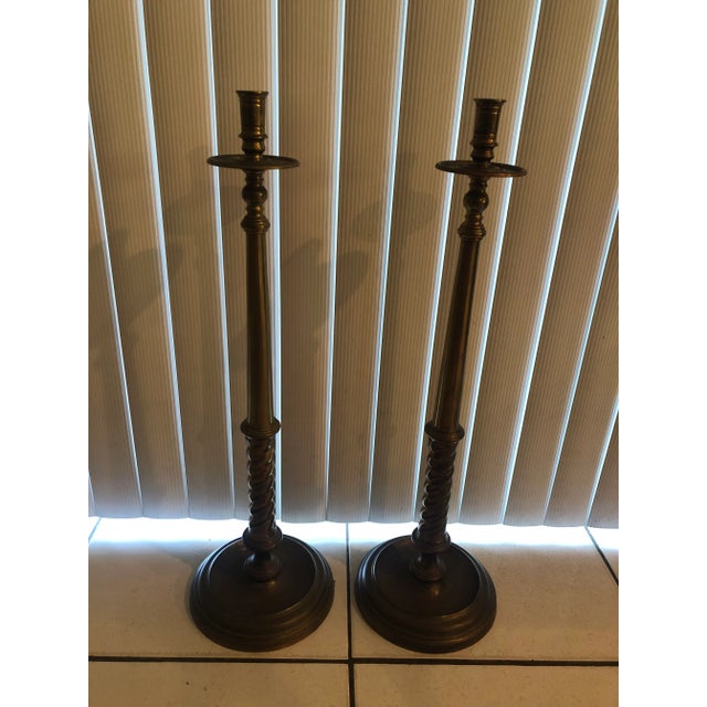 Pair of vintage Maitland Smith heavily patinated brass candlesticks with round base it bears the Maitland Smith gold foil...