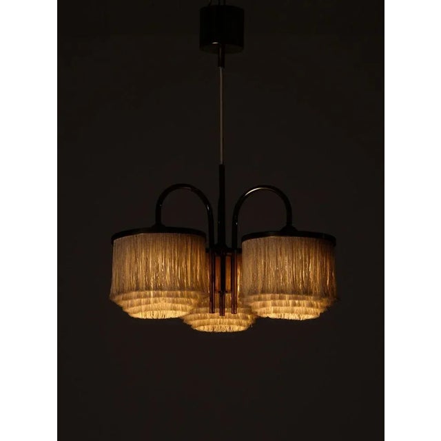 Hans-Agne Jakobsson pendant with ivory white fringes, 1960s. Produced in Sweden by Hans-Agne Jakobsson AB in Markaryd,...