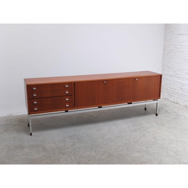 Beautiful large sideboard in teak designed by Werner Wölfers for V-Form around 1965. This V-Form design is from a later...