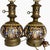 This decorative pair of antique French faience oil lamps was produced by the Faïencerie de Gien in the late 19th century...