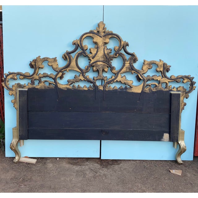 This is an early 20th century antique headboard in the Rococo style. It has elements of gold leaf on the front and back...