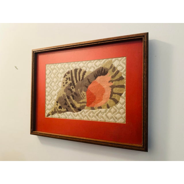 This lovely needlepoint is hand made with careful detail. Nicely framed with glare proof glass, this piece is ready to...