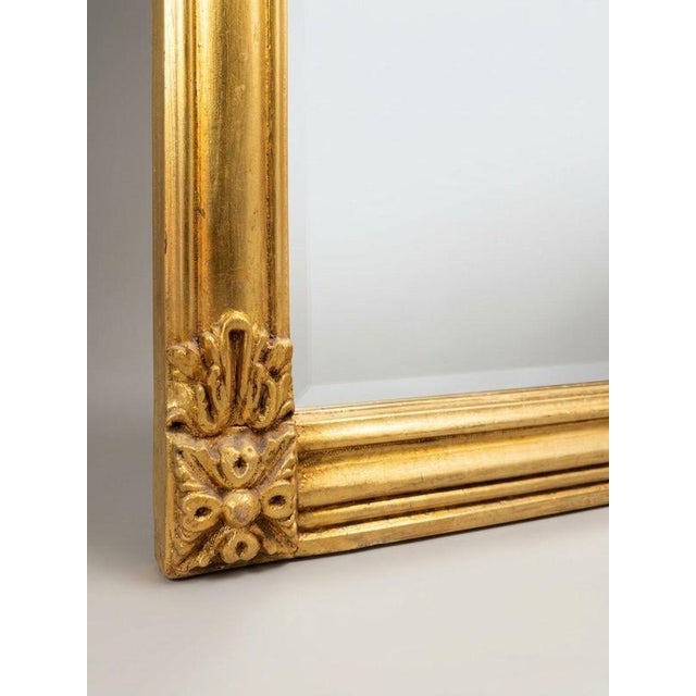 Elevate your space with this elegant Regency style overmantel mirror, featuring a beautifully carved giltwood frame with...