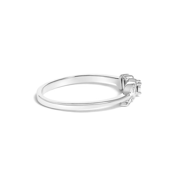 Enveloped in the luxurious luster of rhodium-plated .925 sterling silver, this exquisite ring celebrates the...