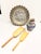 Great decorative set of four vintage kitchen items: a blue stoneware creamer, two hand carved wooden scoops, and a...