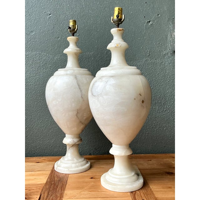 These vintage alabaster urn-form lamps bring a softly luminous presence to a room, pairing creamy stone bases with aged...