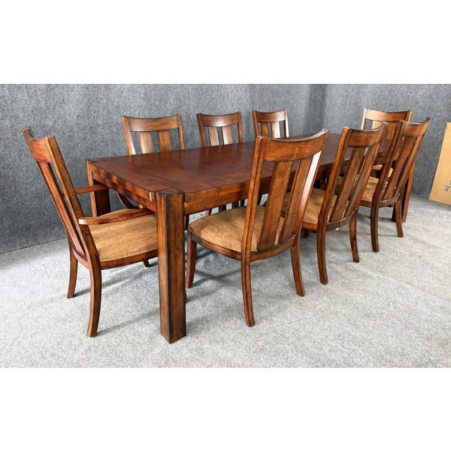 This 9-piece Lane Furniture dining set features a warm wood finish, clean transitional lines, and a spacious rectangular...