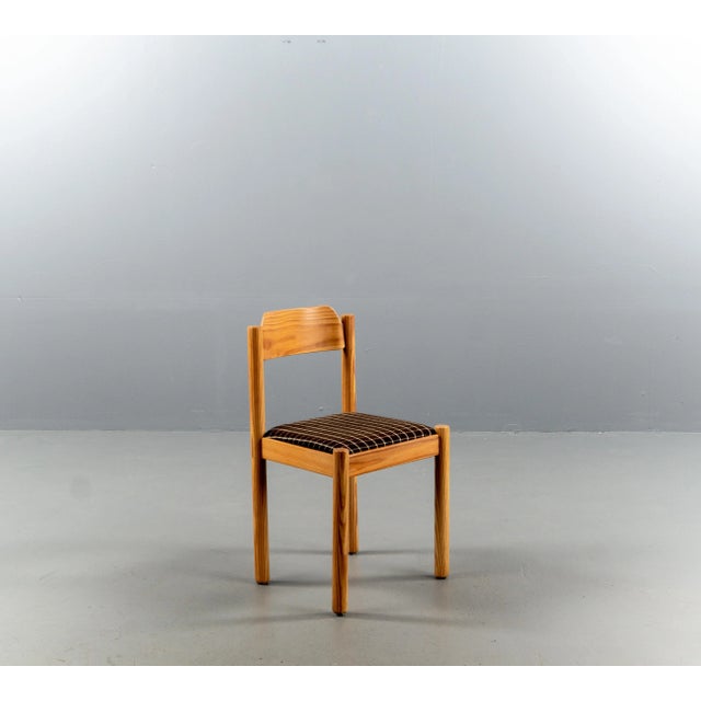 A set of four chairs from the 1970s. The construction is made of softwood. The wood has been refreshed.