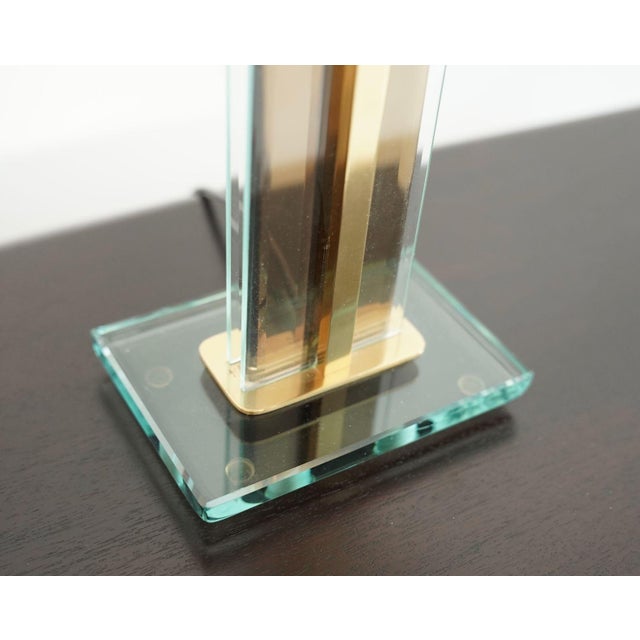 A refined example of Italian modernist lighting from the 1960s, this original table lamp by Fontana Arte showcases the...