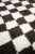 Made-to-order checkerboard shag rug handmade in Morocco from 100% wool. The classic checkered pattern is softened by it's...