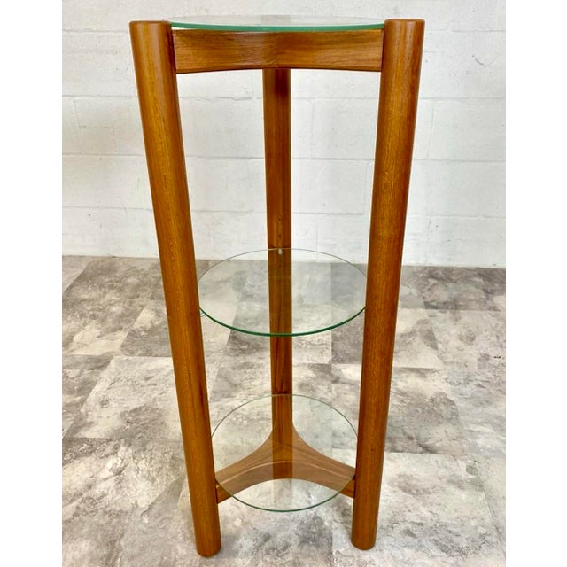 A 1970's Danish Modern three-tier plant stand or shelf by Lysgaard Mobler. The versatile stand can be used for plants, art...
