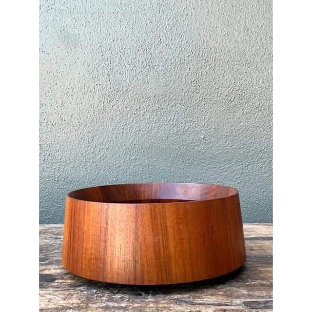 This bowl embraces the clean, confident geometry characteristic of Scandinavian-influenced mid-century design, its wide,...