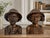A wonderfully expressive matched pair of vintage hand-carved wooden busts from Bali, Indonesia, depicting an elderly rural...