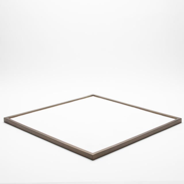 This large square tray by Kifu Paris features a luxurious white shagreen surface framed in bronze patina brass, creating a...