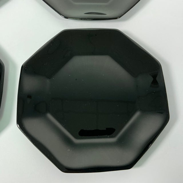 This set of 4 French Octagonal Black Glass Salad Plates are from the 1980s. The contemporary postmodern design is by...