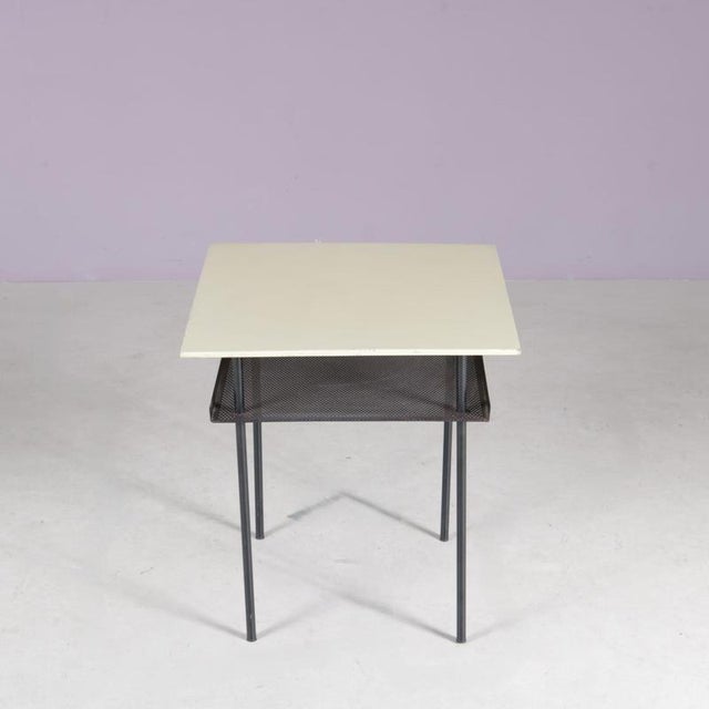 1950s side table designed by Wim Rietveld for Auping. A refined example of Dutch modernist design, featuring a minimalist...