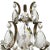 A baroque sconce with electric lighting and with two arms for candles. The frame is polished brass and is pinned with...