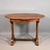 This Antique French Walnut Gueridon Centre Table features a striking book-matched wild grain walnut top with a shaped and...