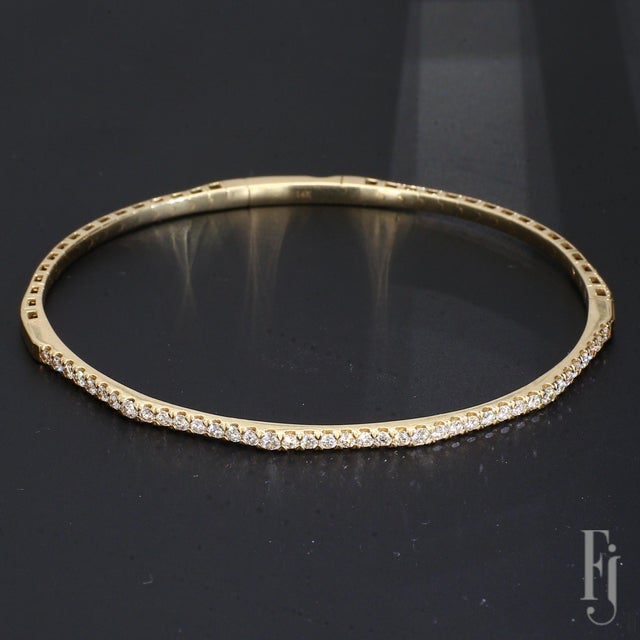 Here is a 14k Yellow Gold Bracelet with Round White Diamonds totaling ~0.85cts. with SI2 clarity, and H color grade....