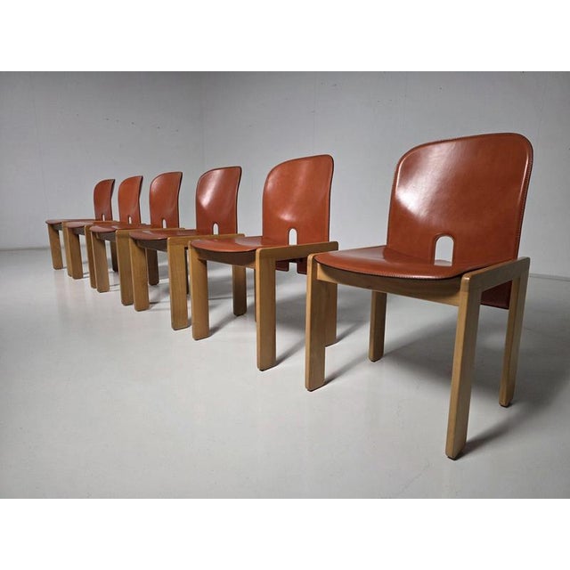 Set of six ‘121’ dining chairs designed by Afra & Tobia Scarpa for Cassina, Italy, 1960s. The chairs combine a solid...