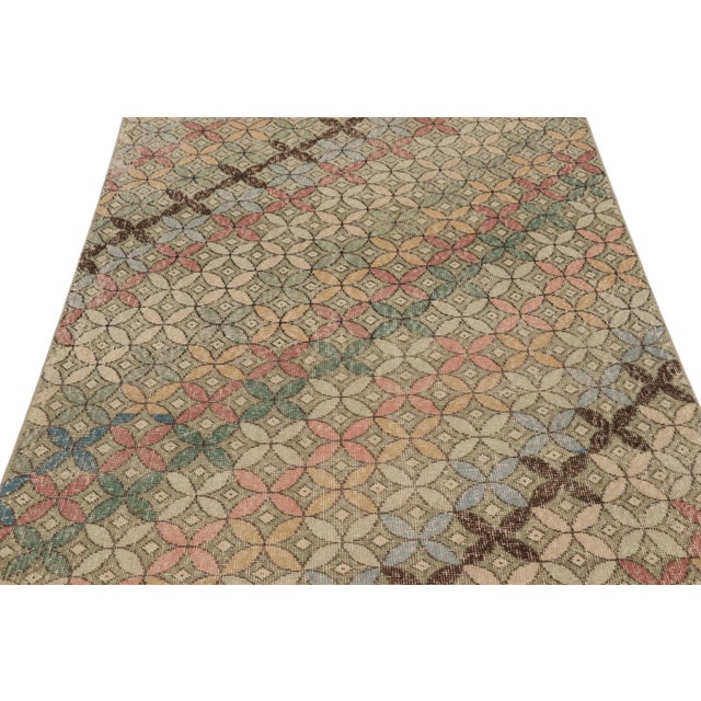 This vintage rug is a 4x8 Turkish distressed piece, made with hand-knotted wool circa mid-20th century. It is an exciting...