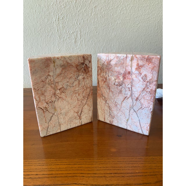 A beautiful pair of vintage Mexican pink onyx bookends, expertly carved from solid natural onyx and polished to a lustrous...