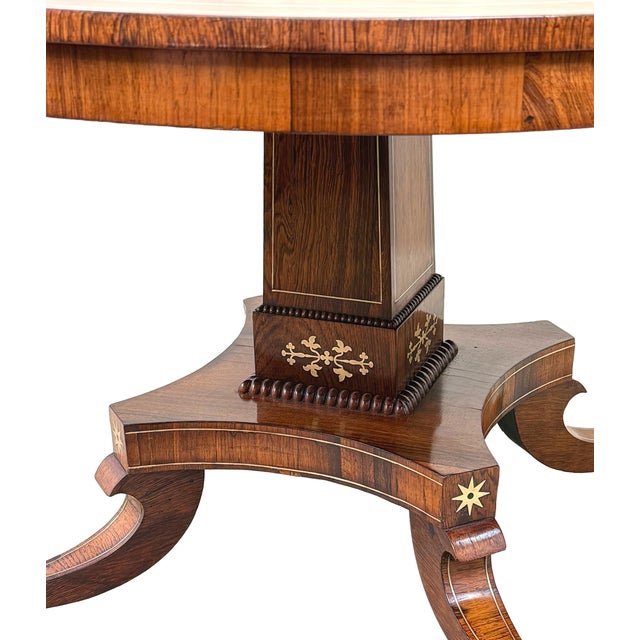 This centre table is of relatively typical design for the height of the Regency period, however it does have a few...