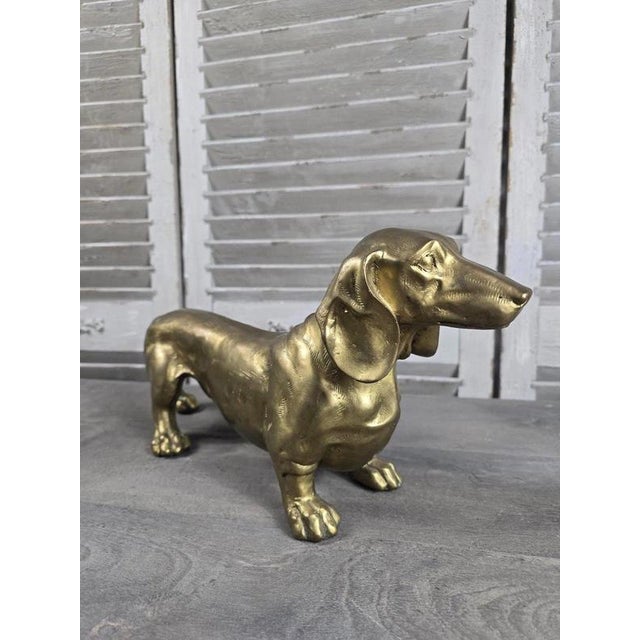 A charming solid bronze sculpture depicting a Dachshund, beautifully modelled with the breed’s unmistakable elongated...