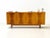 This sideboard is a classic example of high-quality European mid-century furniture and dates stylistically from the 1950s...