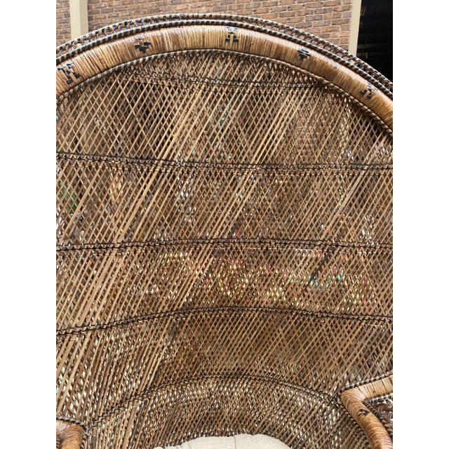 This is a beautiful Emmanuel peacock chair with a cushion and a matching stool. This is perfect for the interior designer...