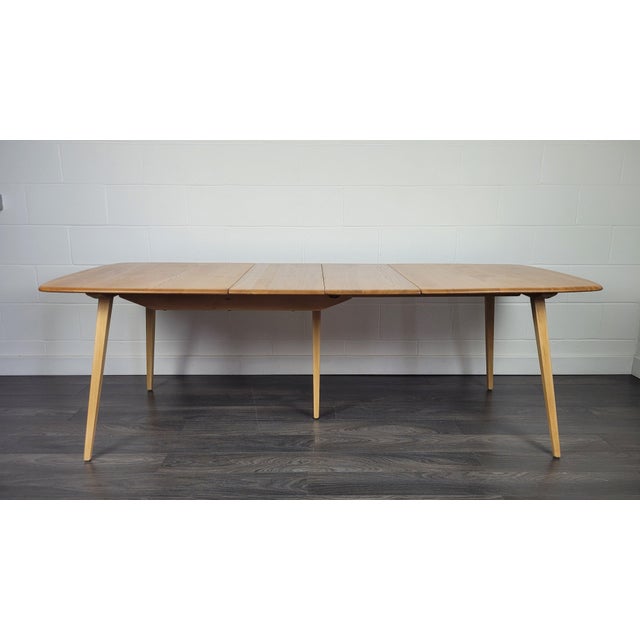 Professionally refinished solid English elm top with a beech underframe and tapered legs. I have official proof of...