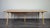 Professionally refinished solid English elm top with a beech underframe and tapered legs. I have official proof of...