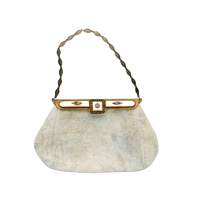 A beautiful vintage white beaded handbag with brass hardware decorated with Mother-Of-Pearl, pastel enamels and marcasite...