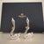 This product is a pair of Mikimoto silver-plated swans with gold bows, designed as wedding place cards. Adds touch of...