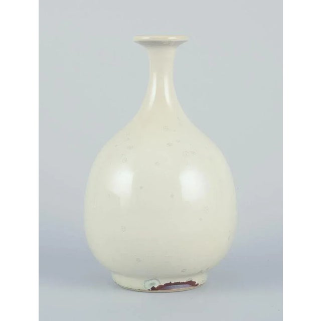Sven Hofverberg, Swedish ceramicist, own studio. Unique ceramic vase. Slender neck. Light crystal glaze. Late 20th...