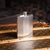 Vintage 20th century English solid silver hip flask of angular form, designed with clean geometric lines and engine-turned...